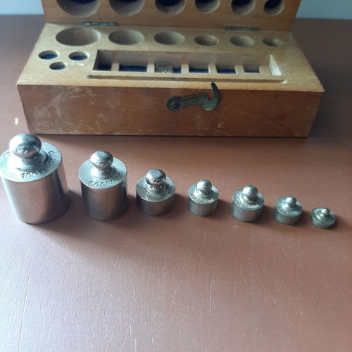 Wooden collectible box with cast iron weights