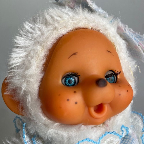 El Greco vintage white monkey plush toy in dress