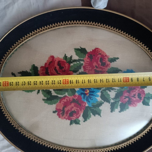 Vintage handmade cross-stitch frame with velvet oval border used