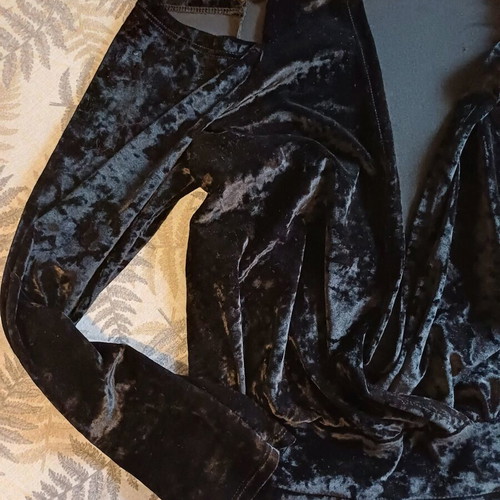 Black velvet jumpsuit like new with deep neckline and off-shoulder design