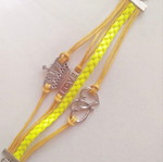 Yellow bracelet with cords new