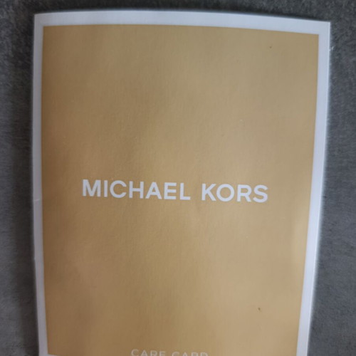 Michael Kors crossbody bag new black with star pattern and silver chains