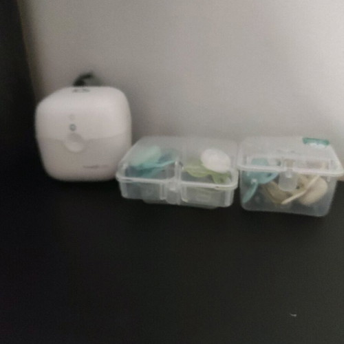 Munchkin pacifier sterilizer like new with cases and pacifiers