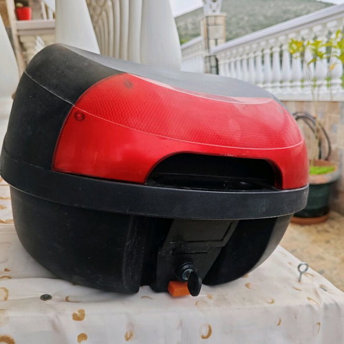 Large motorcycle top case used with key and passenger cushion