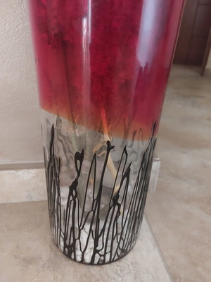 Vase with red top and transparent thick glass bottom