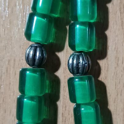 Worry beads used with green translucent beads and metal details