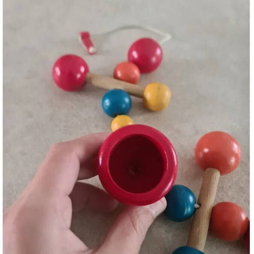 Vintage wooden stroller toy.