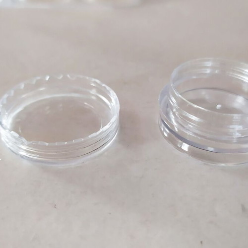 Transparent circular capsules like new, box of 12 pieces