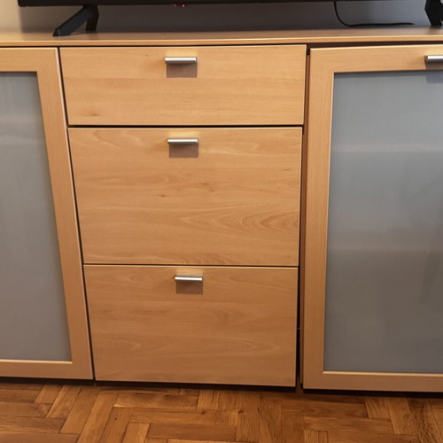 Wooden living room or bedroom furniture with drawers and cabinets