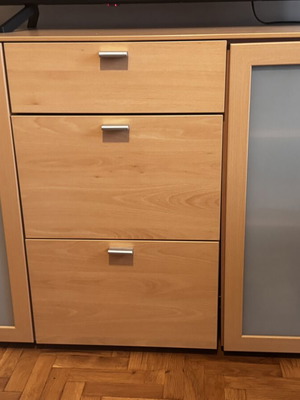 Wooden living room or bedroom furniture with drawers and cabinets