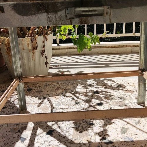 Galvanized small charcoal grill used with skewer supports