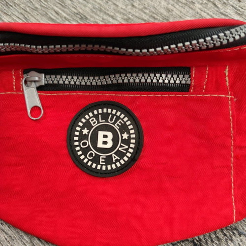Red waist bag like new with 3 compartments
