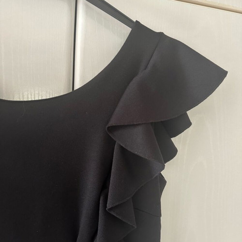 Black dress with structured fabric like new, ruffles and back V, size M