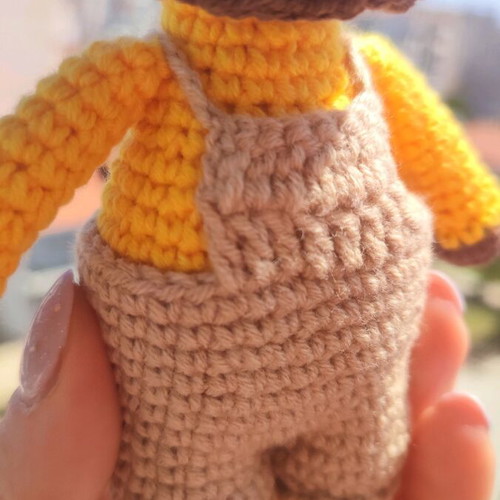 Crocheted lion toy handmade new with beige overalls