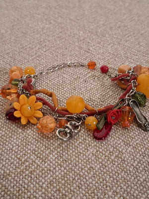 Orange bracelet used with charms, length 15-20 cm
