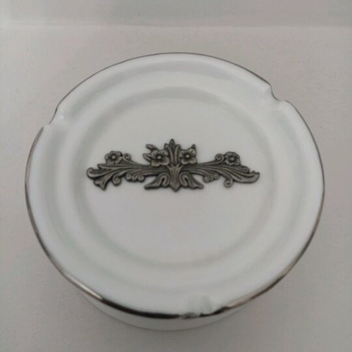 Porcelain ashtray unused with pewter decoration