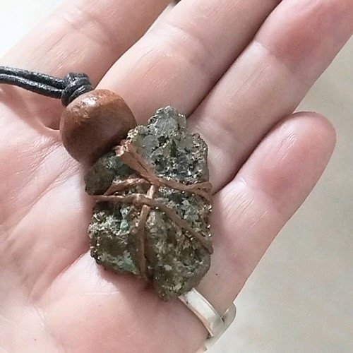 Pendant with pyrite new, gold copper wire and leather