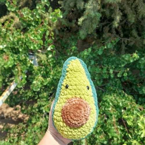 Handmade knitted avocado toy with pit