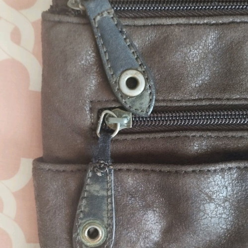 Brown suede crossbody bag used with multiple pockets