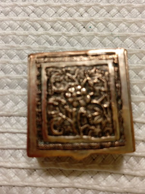 Vintage miniature metal box with floral relief