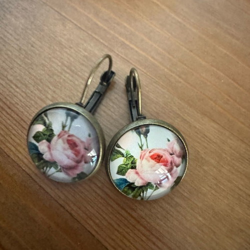 Earrings with rose like new