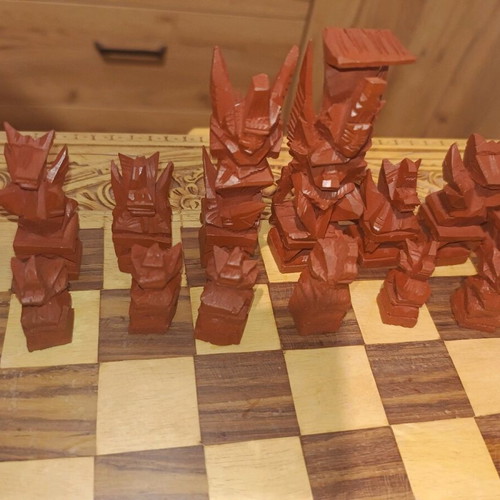 Carved backgammon/chess used with wooden Aztec-style pieces