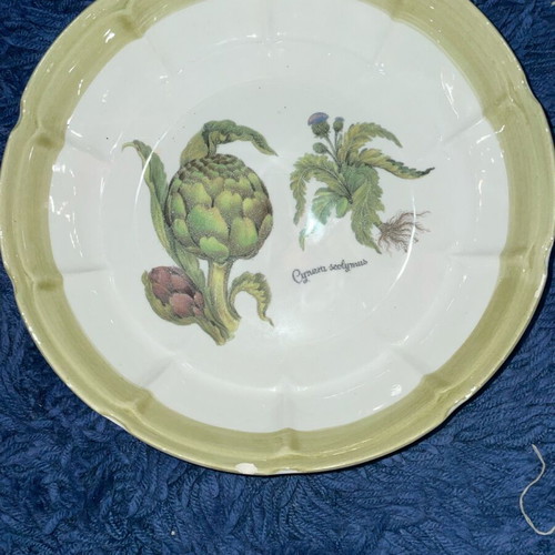 Ceramic serving dish used with artichoke design