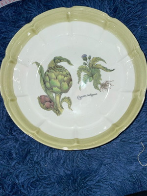 Ceramic serving dish used with artichoke design
