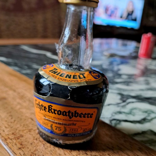 German liqueur with handmade costume like new