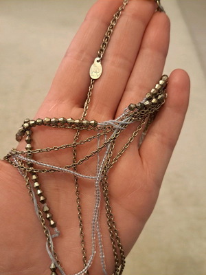 Accessorize long necklace in gold and soft blue shade like new