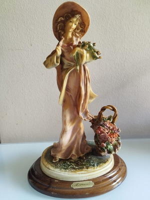 Vintage Italian decorative statue of a girl with roses, used