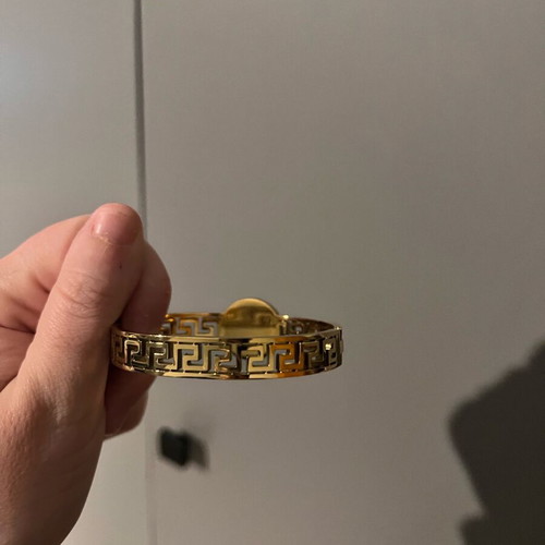 Versace gold hand bracelet like new