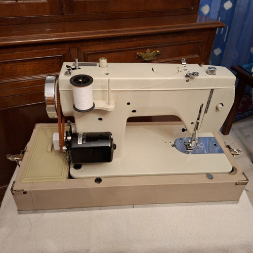 Janone portable sewing machine used with accessories
