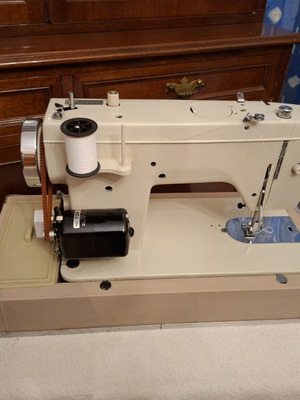 Janone portable sewing machine used with accessories