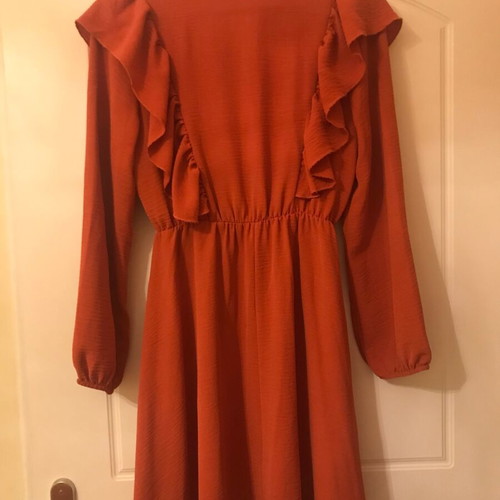 Coral dress like new with ruffles and front frill