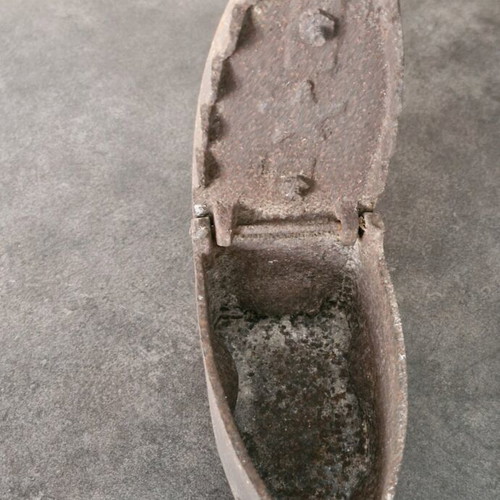 Vintage coal iron used with wooden handle and patina