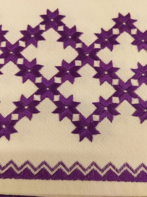 Handicrafts used, set of three table linens with purple star pattern