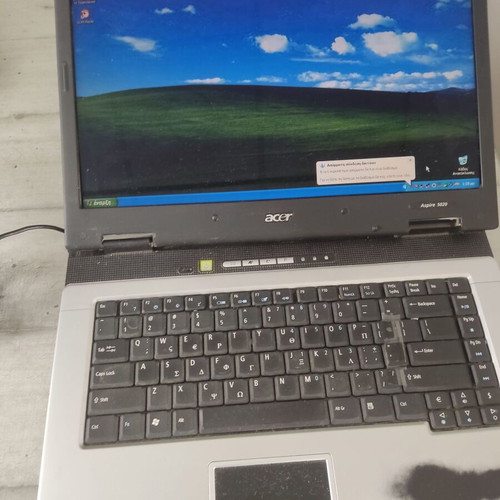 Acer Aspire 5024 laptop used with power adapter and Windows XP