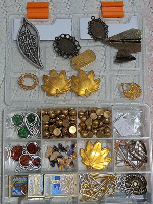 Craft box with metallic elements and beads like new, 12 compartments