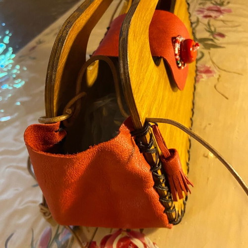 Wooden handmade bag with red leather stitched by hand