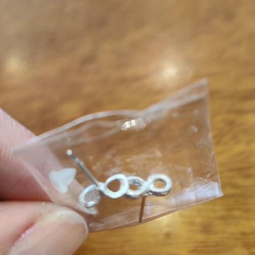 Two pairs of earrings new, pearl and infinity with silicone clasp