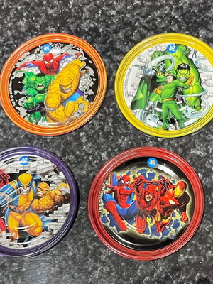 Marvel metal caps 4 large and 4 small like new