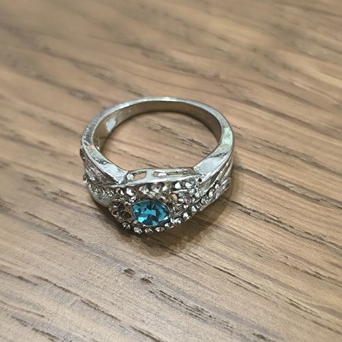 Silver vintage ring with blue zircon and white stones