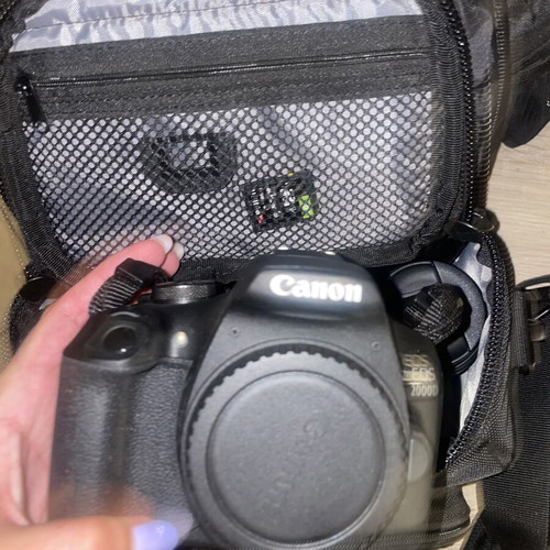 Canon EOS 1200D camera kit with lenses, memory card, battery, charger, and carrying bag