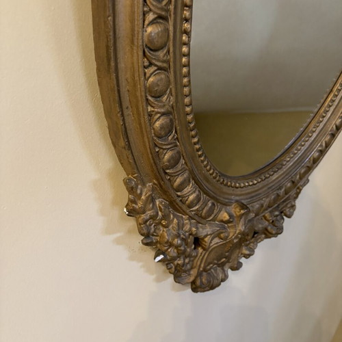 Baroque oval wall mirror with carved plaster frame, used, 104×61 cm
