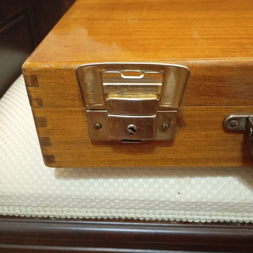 Vintage wooden suitcase made of genuine teak wood, used