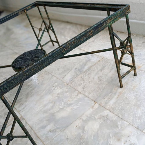 Metal table used with ceramic decoration and antique finish