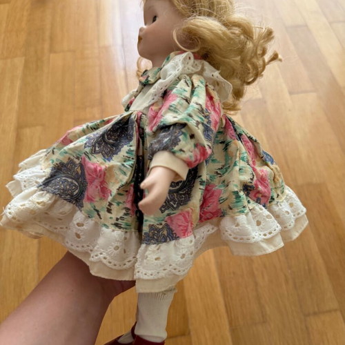Porcelain doll like new with colorful dress and straw hat