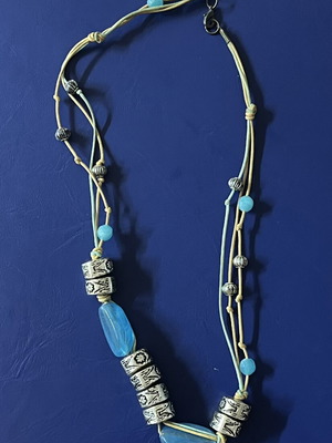 Handmade necklace with decorative beads and blue stones like new