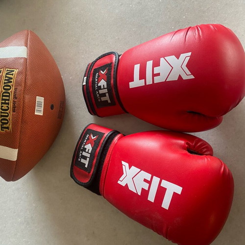 Boxing gloves and rugby ball like new
